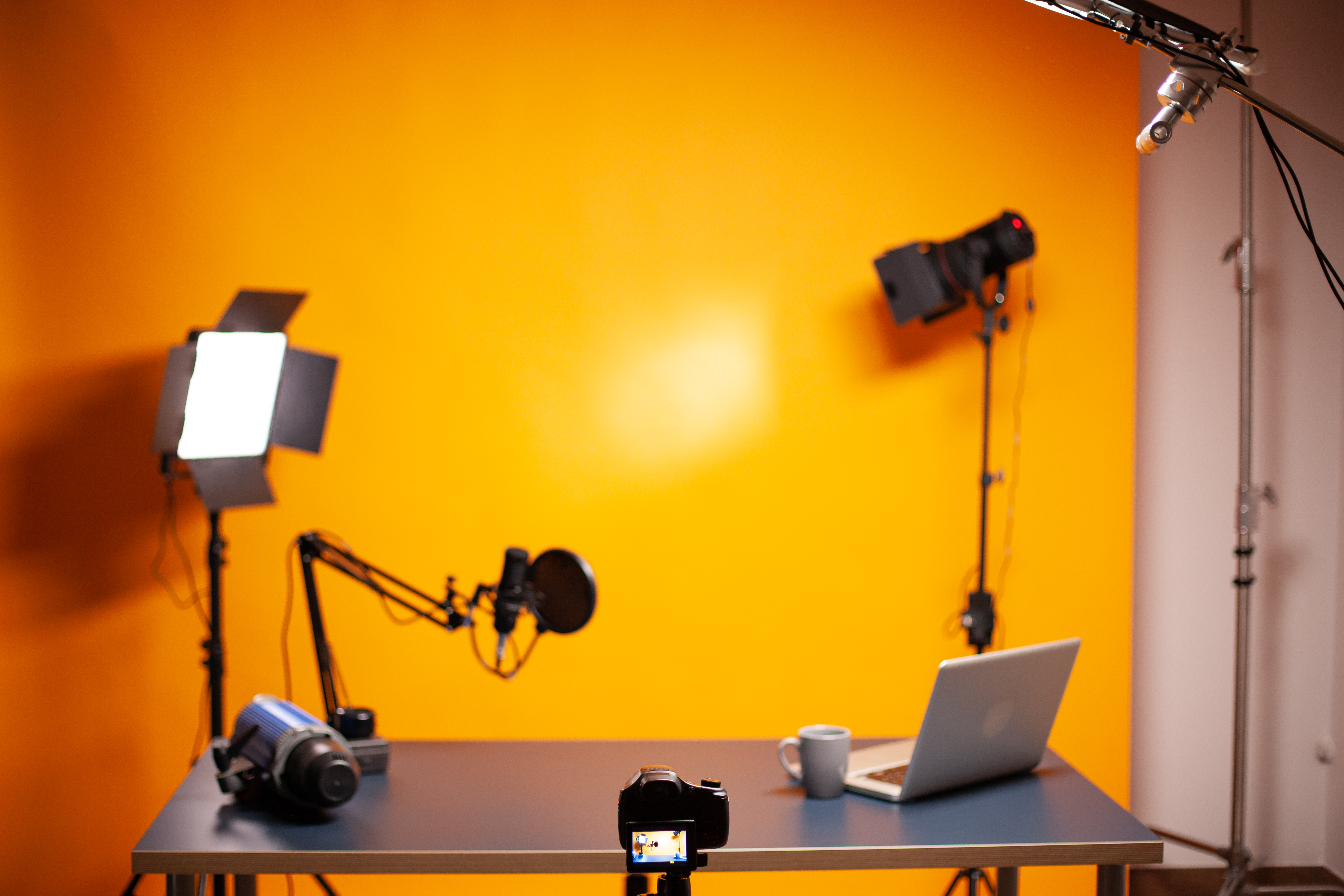 professional-podcast-vlogging-setup-studio-with-yellow-wall.jpg